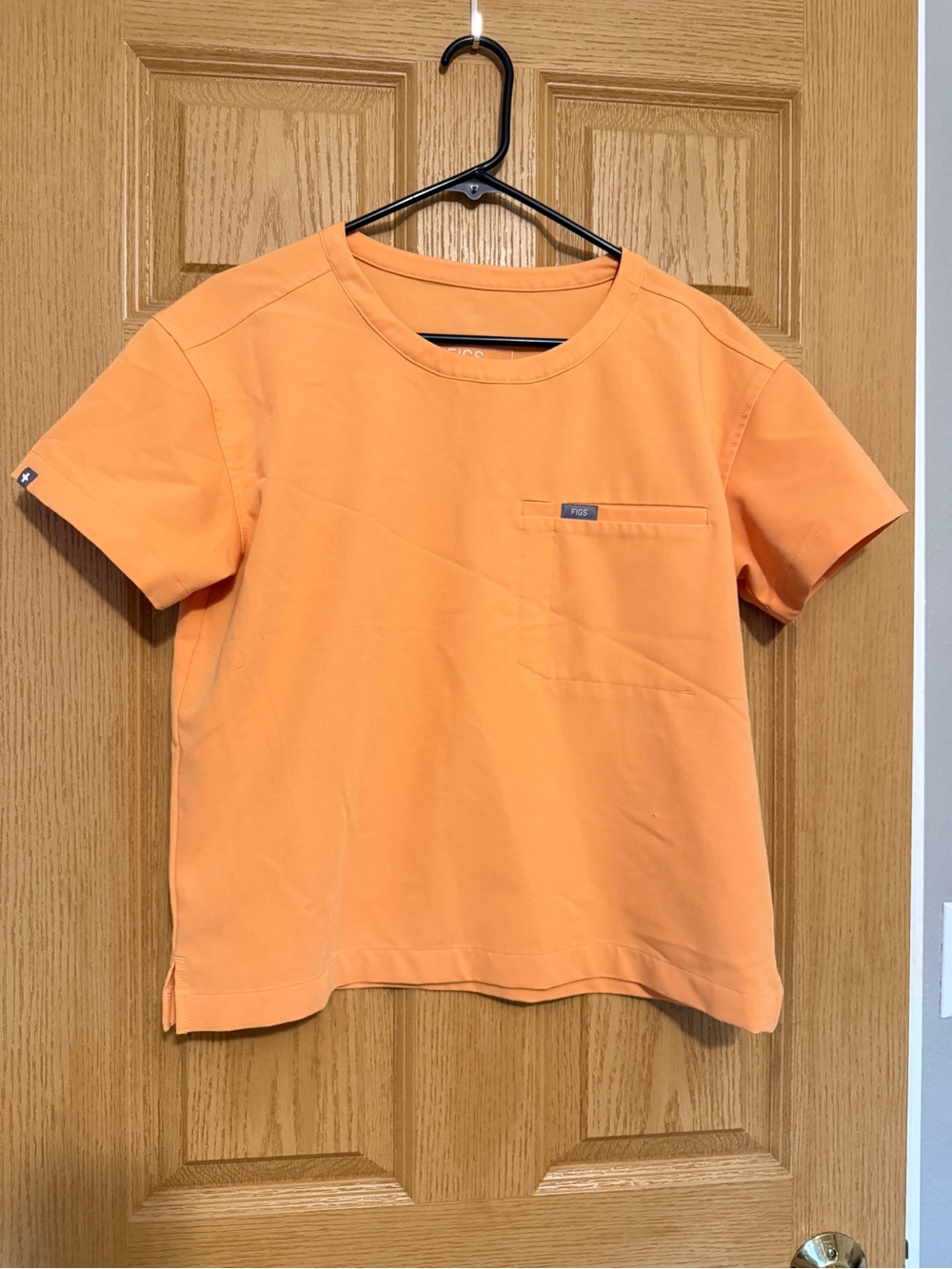 FIGS Women's orange scrub top